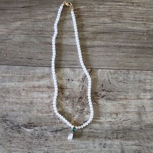 Elegant Pearl Necklace with Green Accent